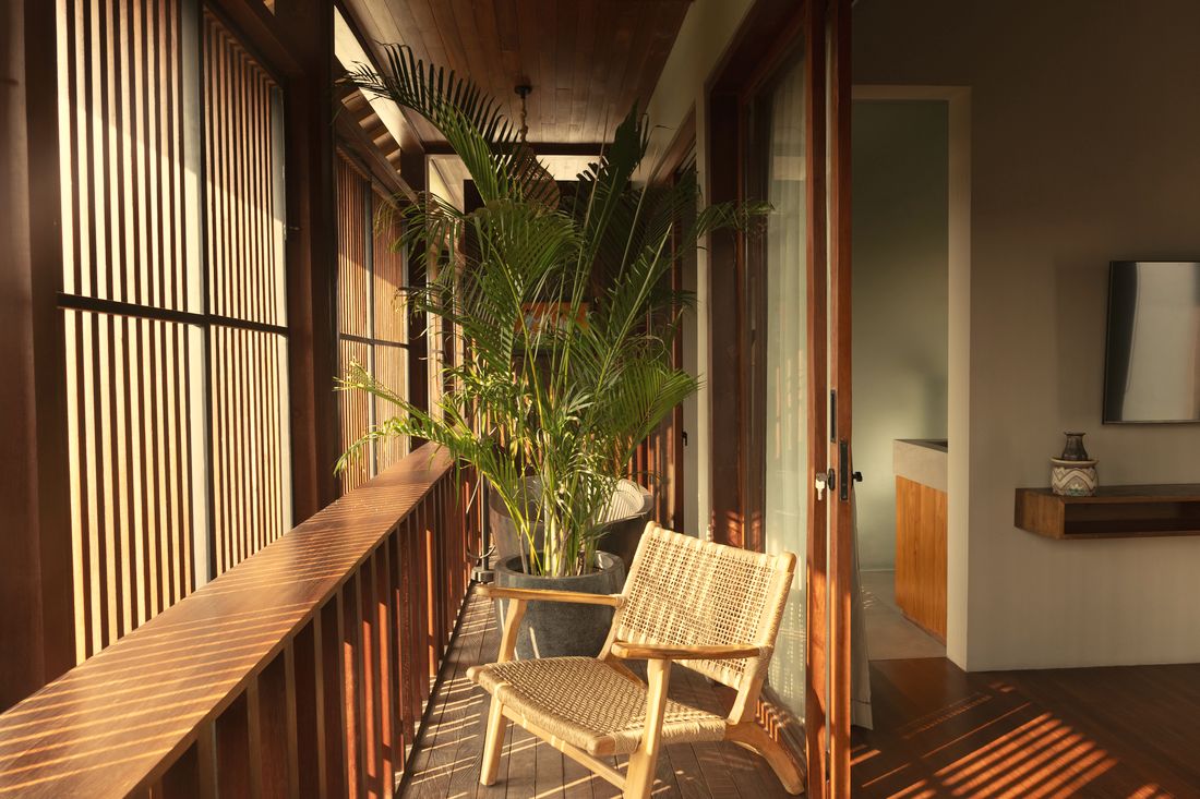 Upstairs balcony with rattan chair