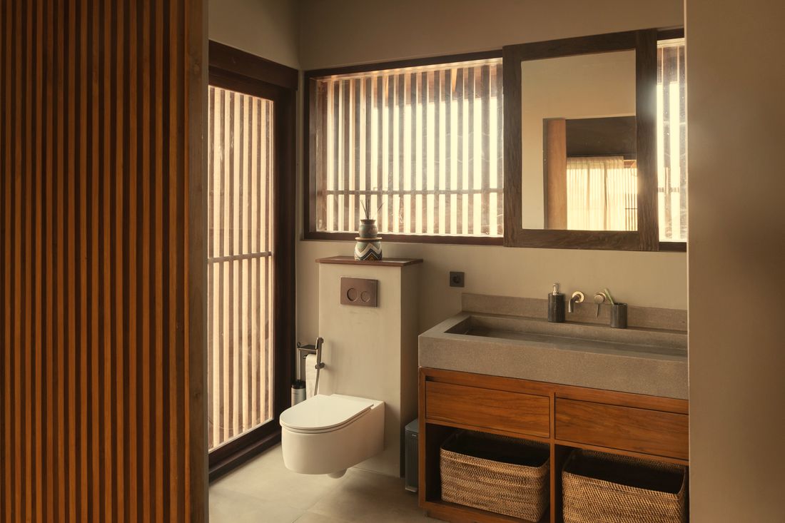 Bathroom vanity with timber cabinet and slatted window